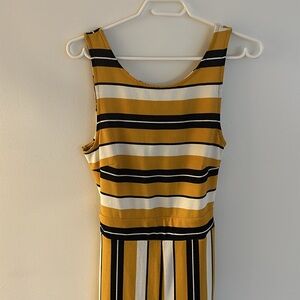 One piece pantsuit. Sleeveless.